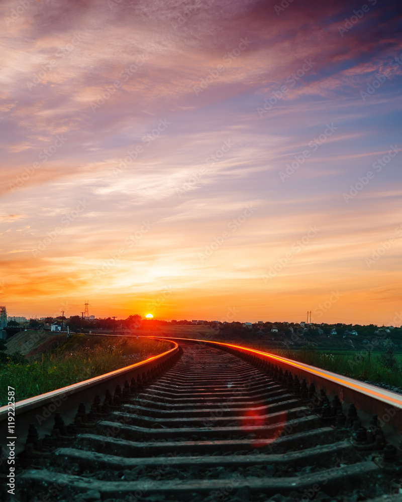 sunset over railroad in violet sky with clouds sunset over railroad in violet sky with clouds