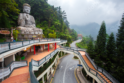 Genting Highlands, Malaysia - AUGUST 19, 2016: Large stone Buddha statue at Chin Swee Caves Temple in Genting Highlands, Pahang, Malaysia photo