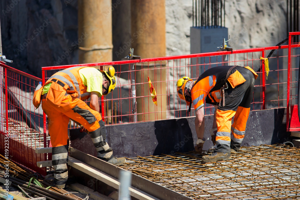 Reinforcing Iron workers in construction site StockFoto Adobe Stock