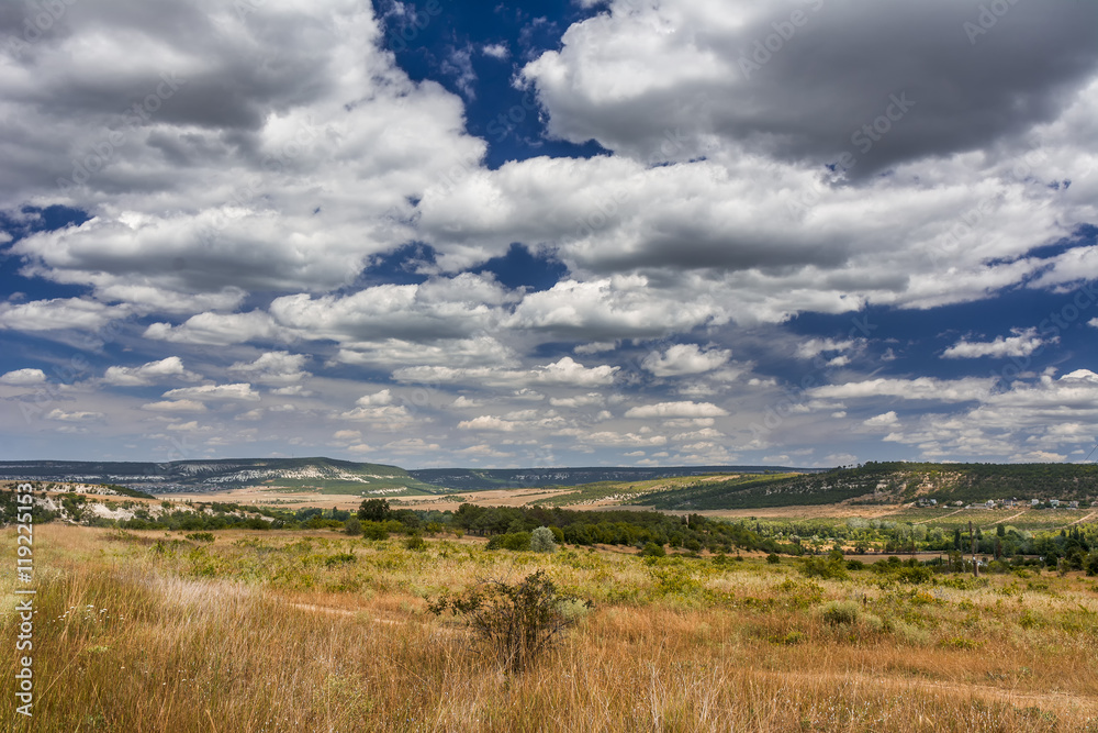 Mountain valley with a cloudy sky. Natural summer landscape. Mountain valley with a cloudy sky. Natural summer landscape.