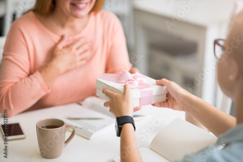 Positive woman getting present