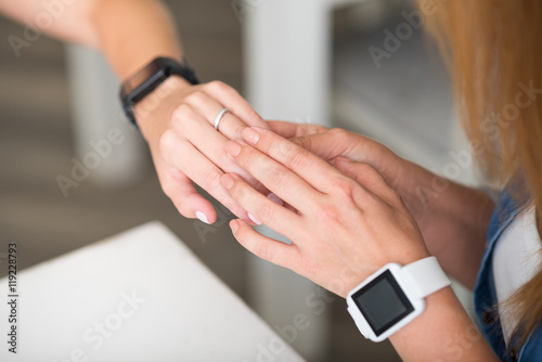 Pleasant daughter showing ring to her mother