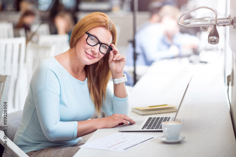 Pleasant senior woman using laptop Pleasant senior woman using laptop