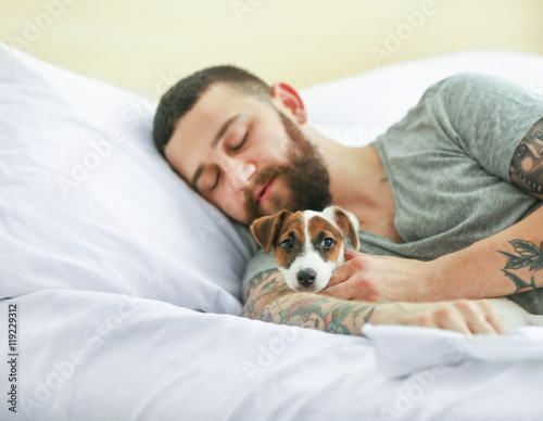Handsome man with cute dog ...