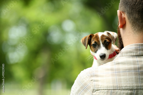 Man with cute dog in spring...