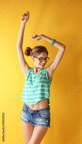 Beautiful girl on yellow ba...