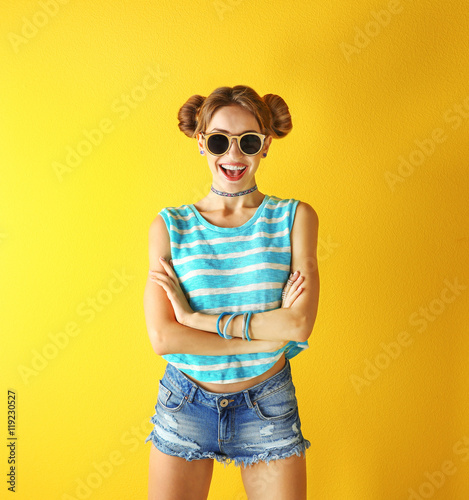 Beautiful girl on yellow ba...