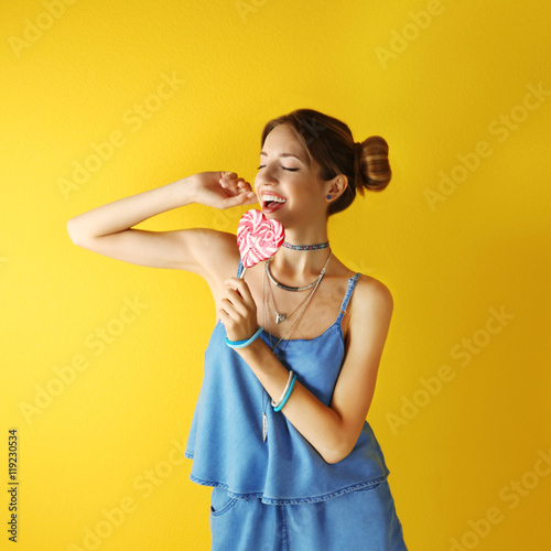 Beautiful girl with candy o...