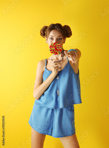 Beautiful girl with candy o...