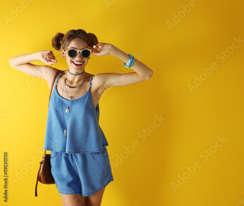 Beautiful girl on yellow ba...