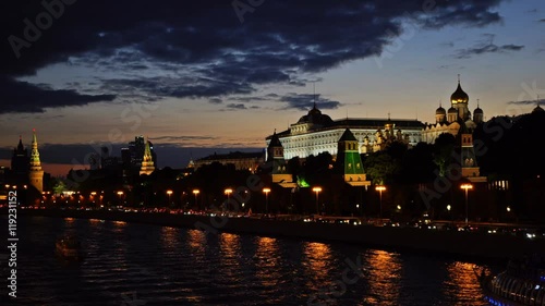 Moscow Kremlin, Moskva River quay, Grand Kremlin Palace, Cathedral of the Annunciation,  Cathedral of the Archangel and the skyscrapers. Sunset. UHD - 4K. August 26, 2016. Moscow. Russia