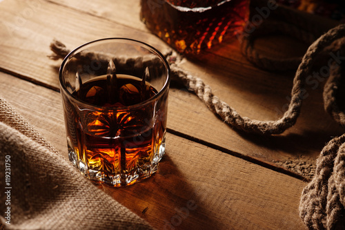 Canvas Print Glass of whiskey and rope