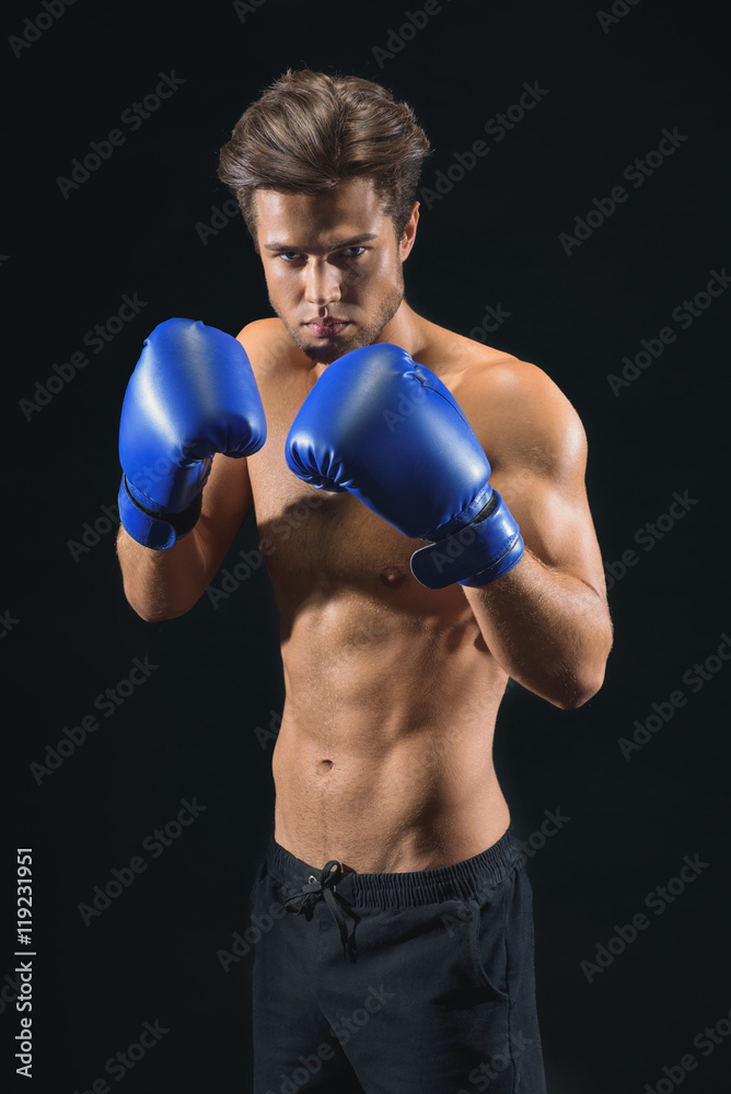 Confident young man preparing for box