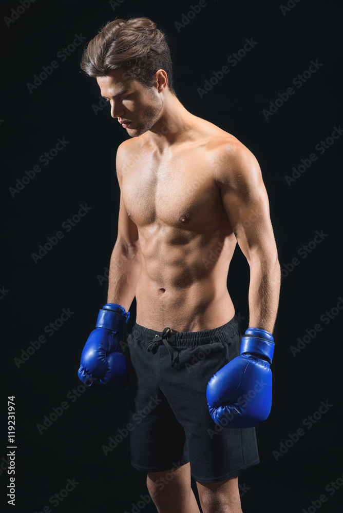 Skillful male fighter ready to box