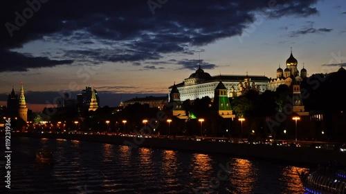 Moscow Kremlin, Moskva River quay, Grand Kremlin Palace, Cathedral of the Annunciation,  Cathedral of the Archangel and skyscrapers. Sunset. Time-lapse. UHD - 4K. August 26, 2016. Moscow. Russia