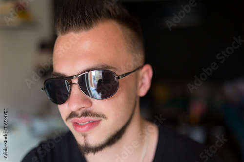 Trendy young man with sunglasses. © Myvisuals