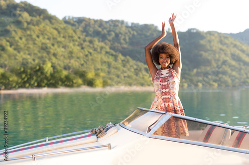 Afro American attractive girl on a yacht at summer day