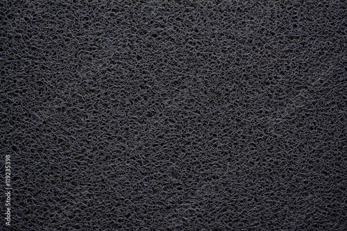 Black doormat texture background.
