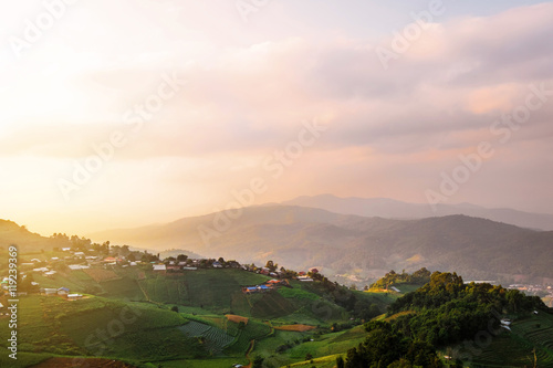 Mountain valley with local village during bright sunrise, Beautiful natural landscape