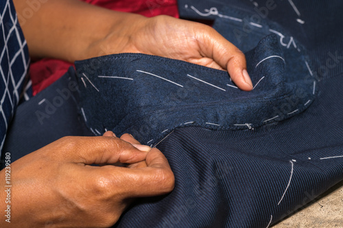 Production process of suit tailoring, hand sewing of a tailored jacket 