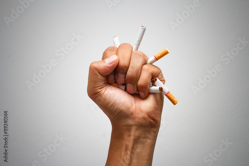  Male hand crushing cigarette, Concept Quitting smoking,World No Tobacco Day photo