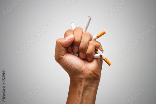  Male hand crushing cigarette, Concept Quitting smoking,World No Tobacco Day