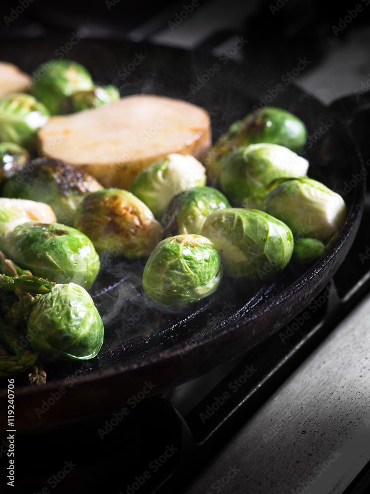 close up view of nice fresh vegetables is being fried