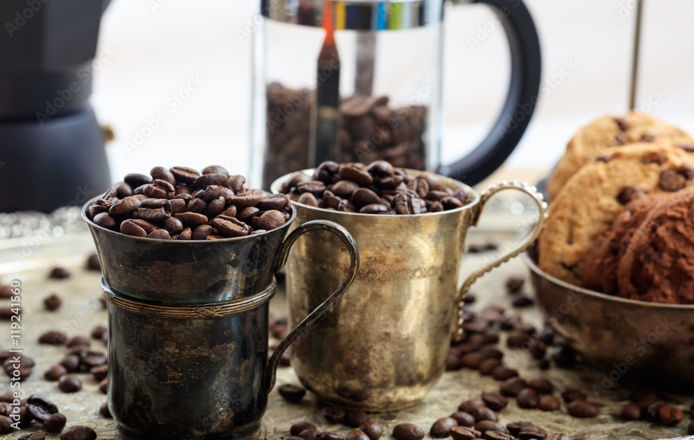 Two cups with coffee beans