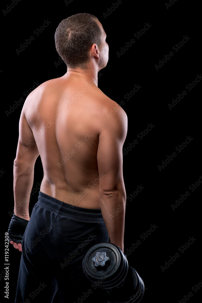 Portrait of a bodybuilder with dumbbells view from the back on a