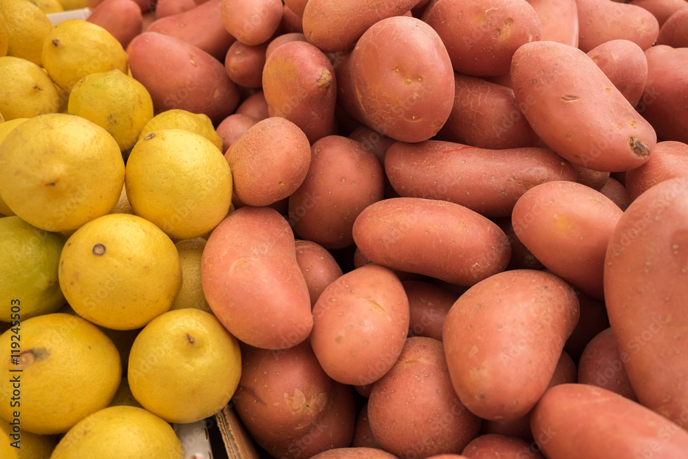 Fresh organic lremons and red potatoes sold on market Fresh organic lremons and red potatoes sold on market