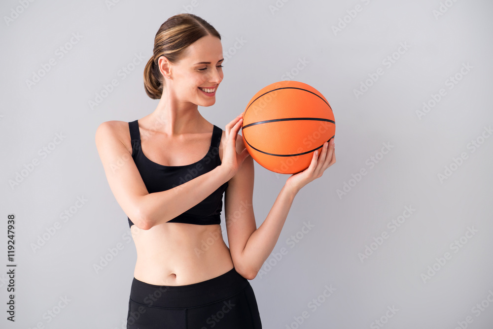 Nice young woman with ball