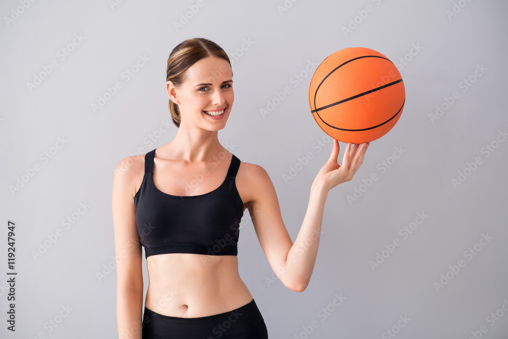 Pretty young woman with ball