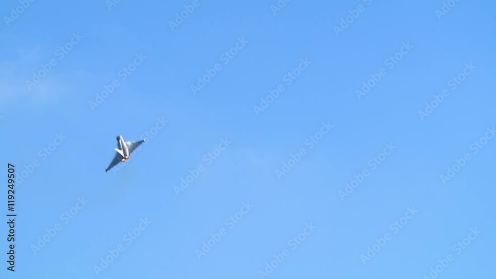 Slow motion display of a multi-role fighter combat aircraft at an air show Slow motion display of a multi-role fighter combat aircraft at an air show