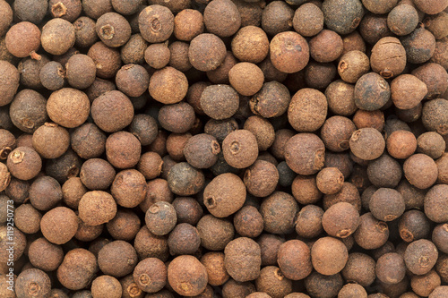 Organic dry False Black Pepper (Embelia Ribes). Macro close up background texture. Top view.