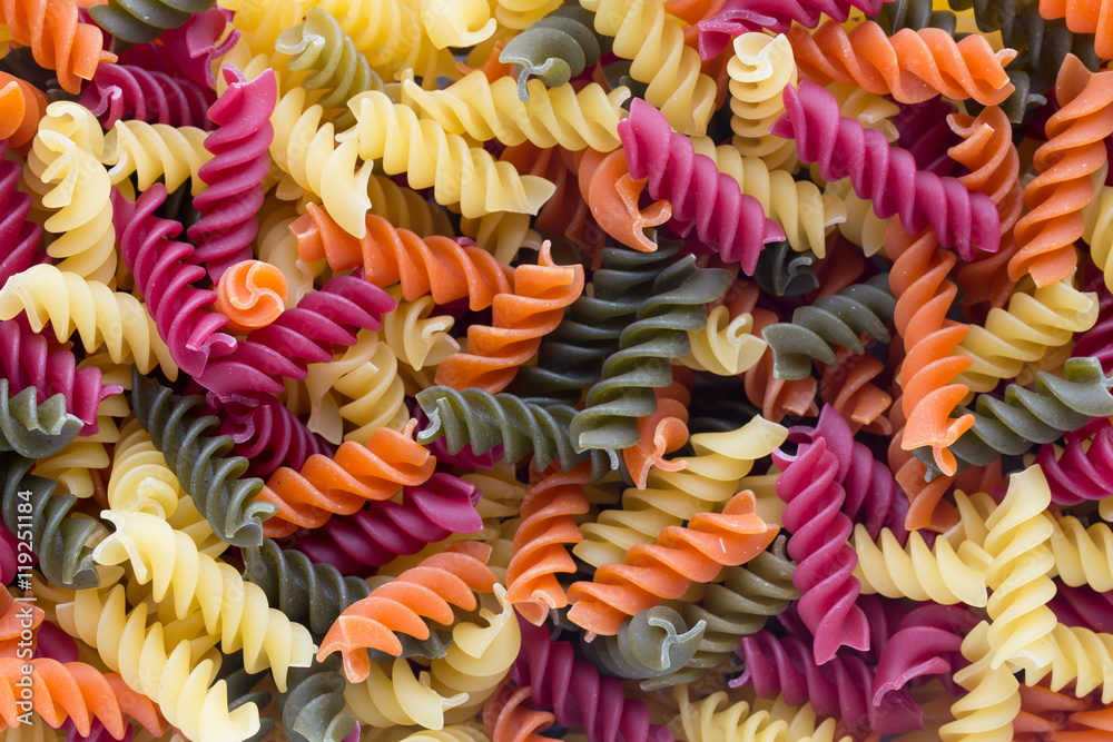 Closeup of raw eco macaroni pasta background.