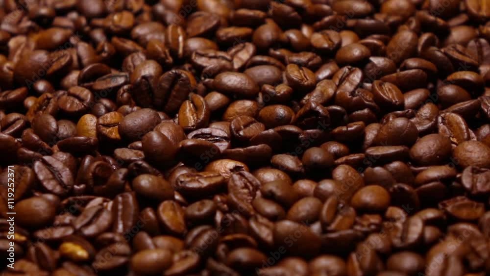 Throwing roasted coffee beans on pan, super slow motion shot Throwing roasted coffee beans on pan, super slow motion shot