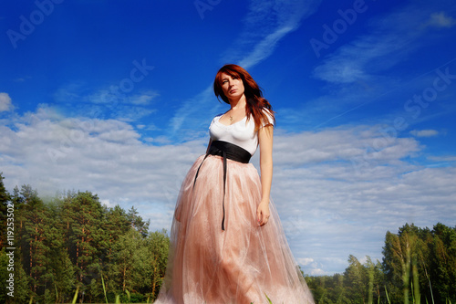 beautiful girl in a long pink skirt