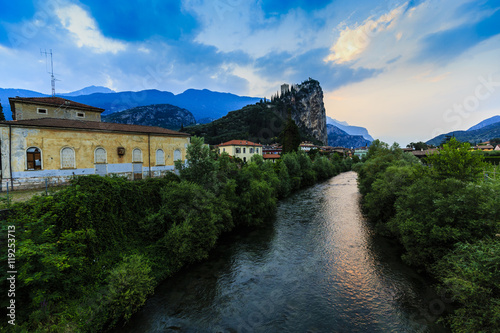 Views of the Arco river and castle in background. Arco, Trentino, Italy.
