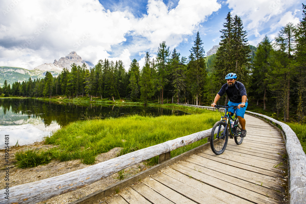 Fototapeta premium Mountain biking in the Dolomites, Misurina, Italy