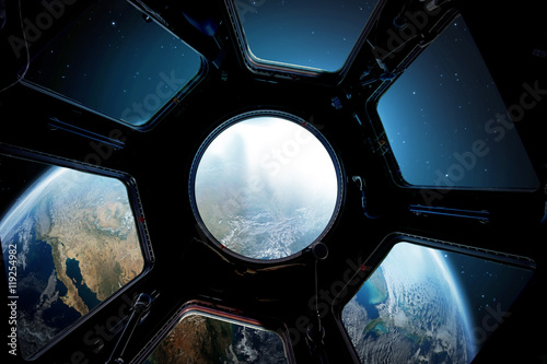 Fototapeta Naklejka Na Ścianę i Meble -  Earth and star in spaceship window porthole. Elements of this image furnished by NASA