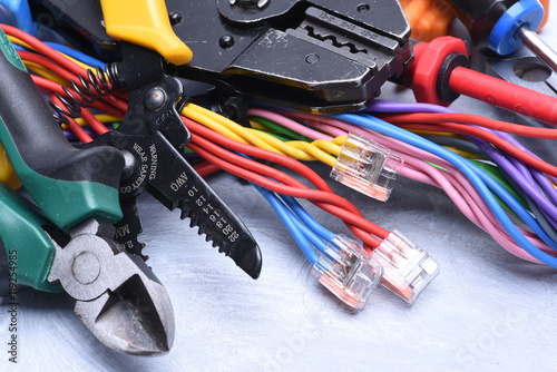 Set of tools for electrician and electrical cables
