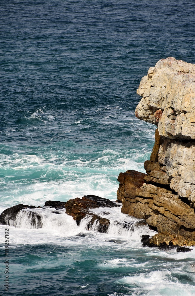 Seascape with rocks in the blue green Atlantic Ocean