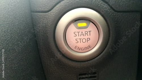 Asian Mans Finger Press On Button To Start Engine Of Car