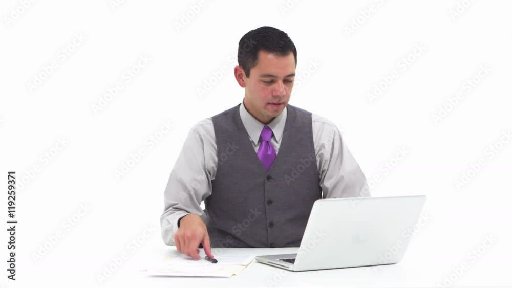 Businessman using laptop and taking notes Businessman using laptop and taking notes