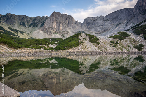 Anazing view of roks around Sinanitsa Peak and reflection in the lake, Pirin Mountain, Bulgaria