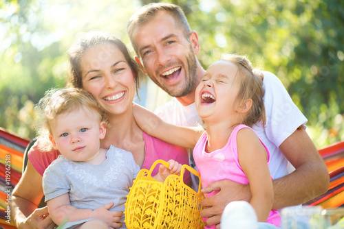 Happy joyful young family with children