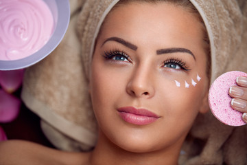 Pretty young woman with facial mask