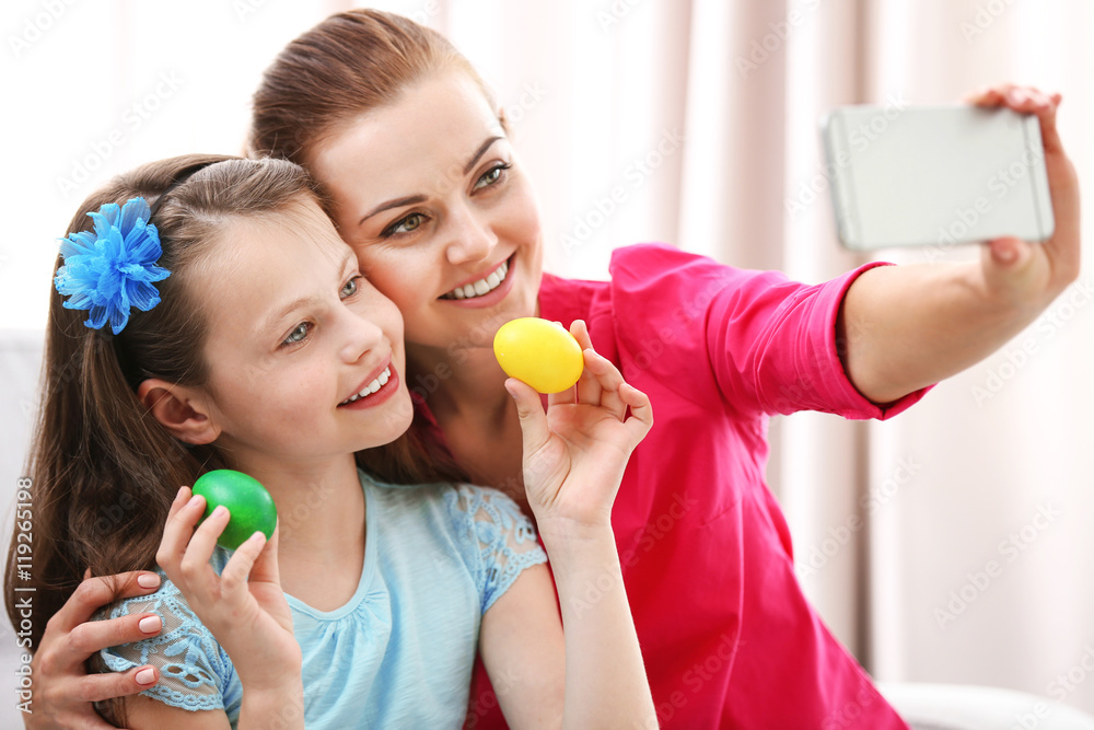 Mother and daughter taking selfie at Easter time Mother and daughter taking selfie at Easter time