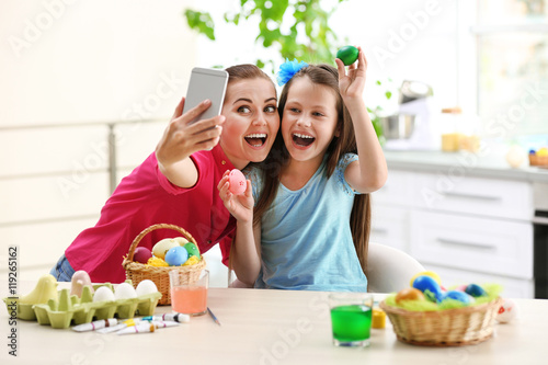 Mother and daughter taking ...