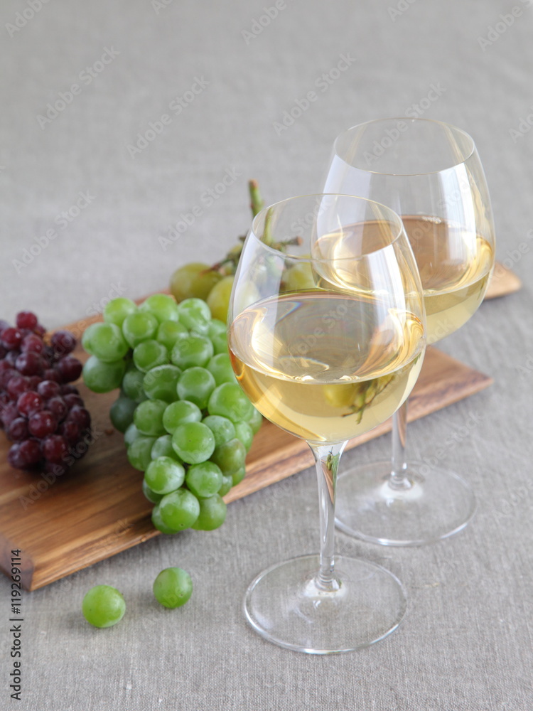 Glasses of wine with grapes on wooden board Glasses of wine with grapes on wooden board